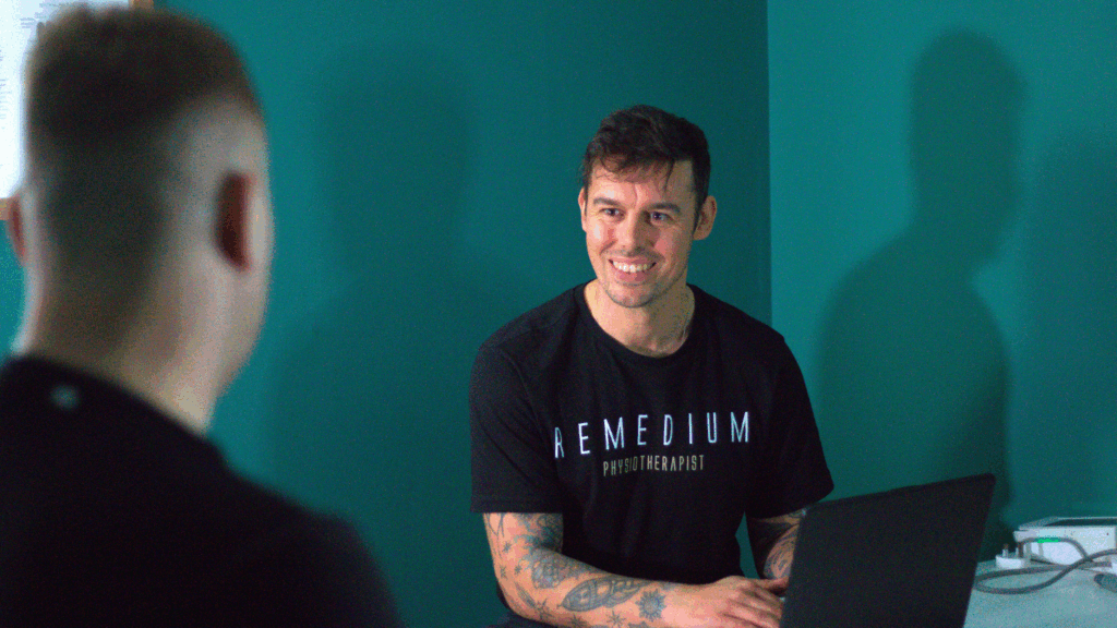 Physiotherapist treating a client in Hoxton clinic